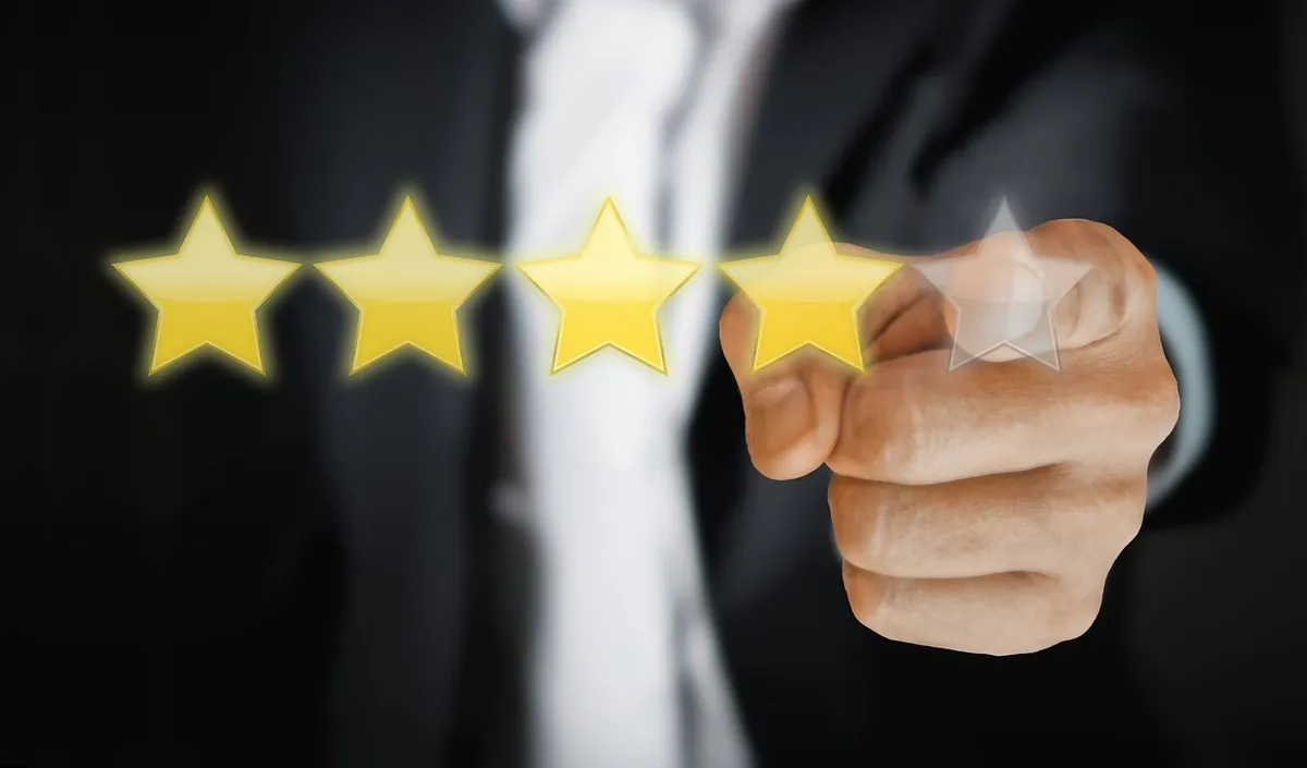 Customer leaving a five star Google review on smartphone